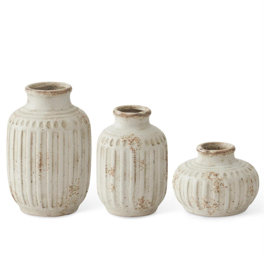 weathered cream ceramic vases