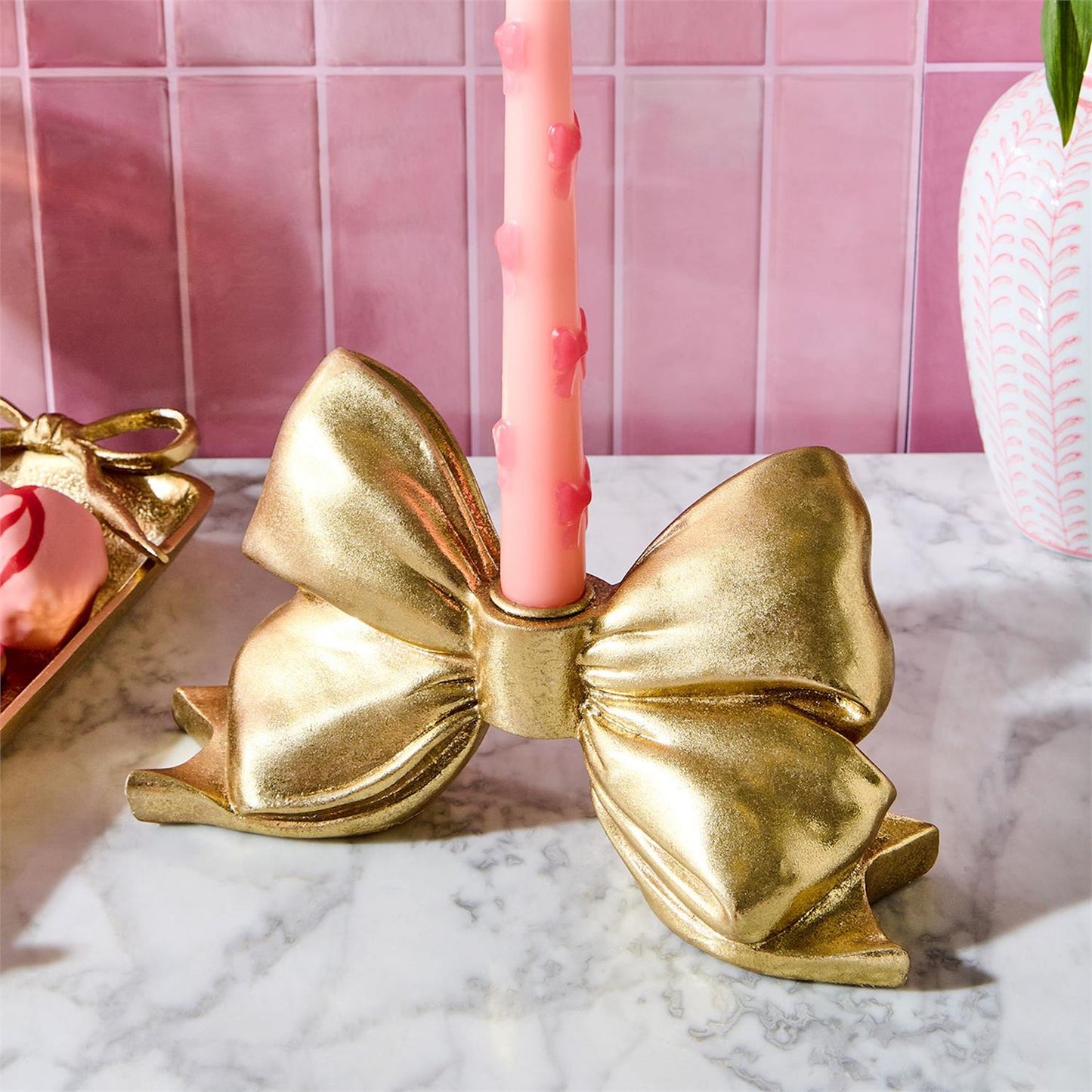 large gold bow taper holder