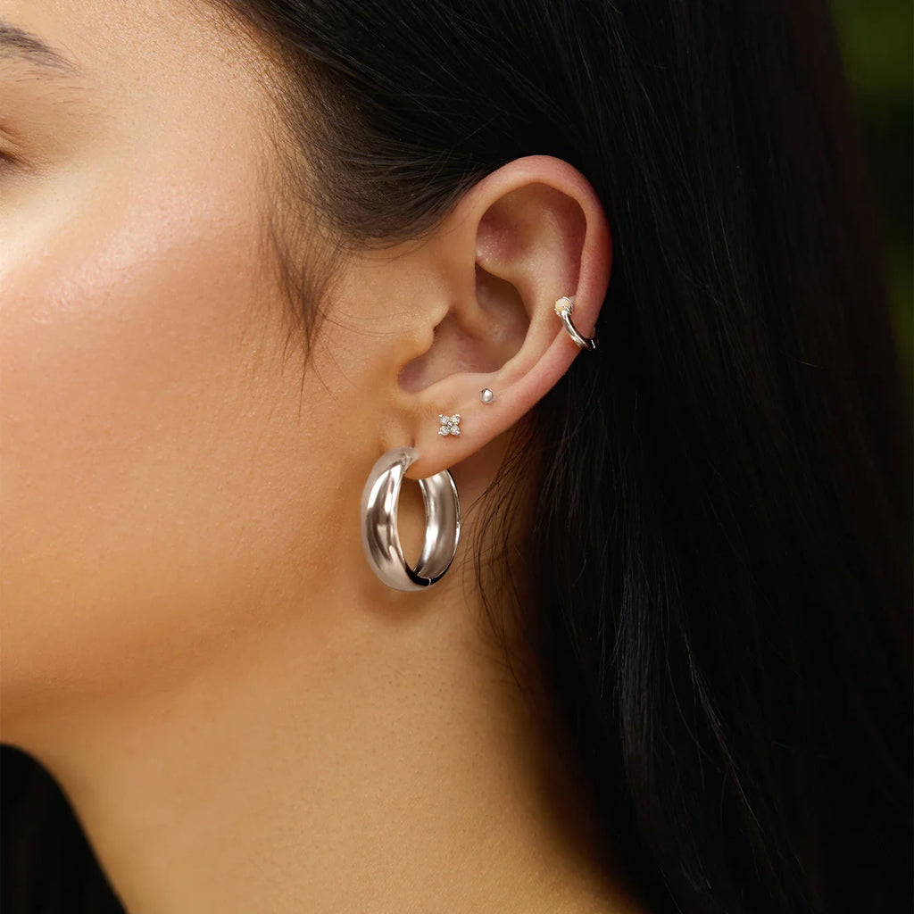 silver four petal studs